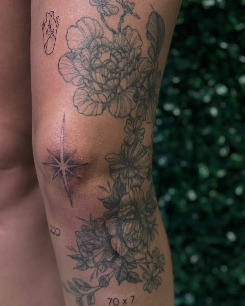 Fine line florals on the shoulder