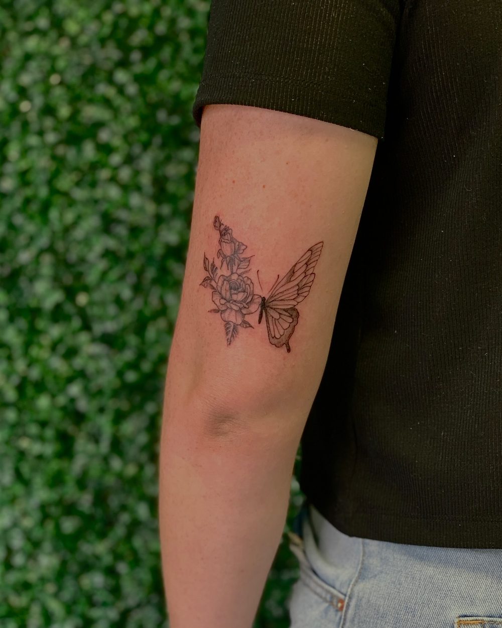 Fine line moth with florals on the forearm